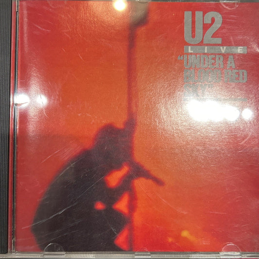 CD U2 ‎– Under A Blood Red Sky (Live) Ed. Americana 2ª mano - DISCOS NAKASHA