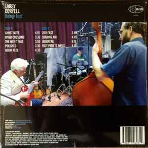 LP Larry Coryell ‎– Heavy Feel Nuevo precintado - DISCOS NAKASHA